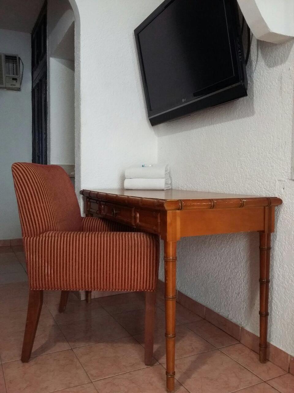 Capital O Zona Dorada Inn, Масатлан Экстерьер фото
